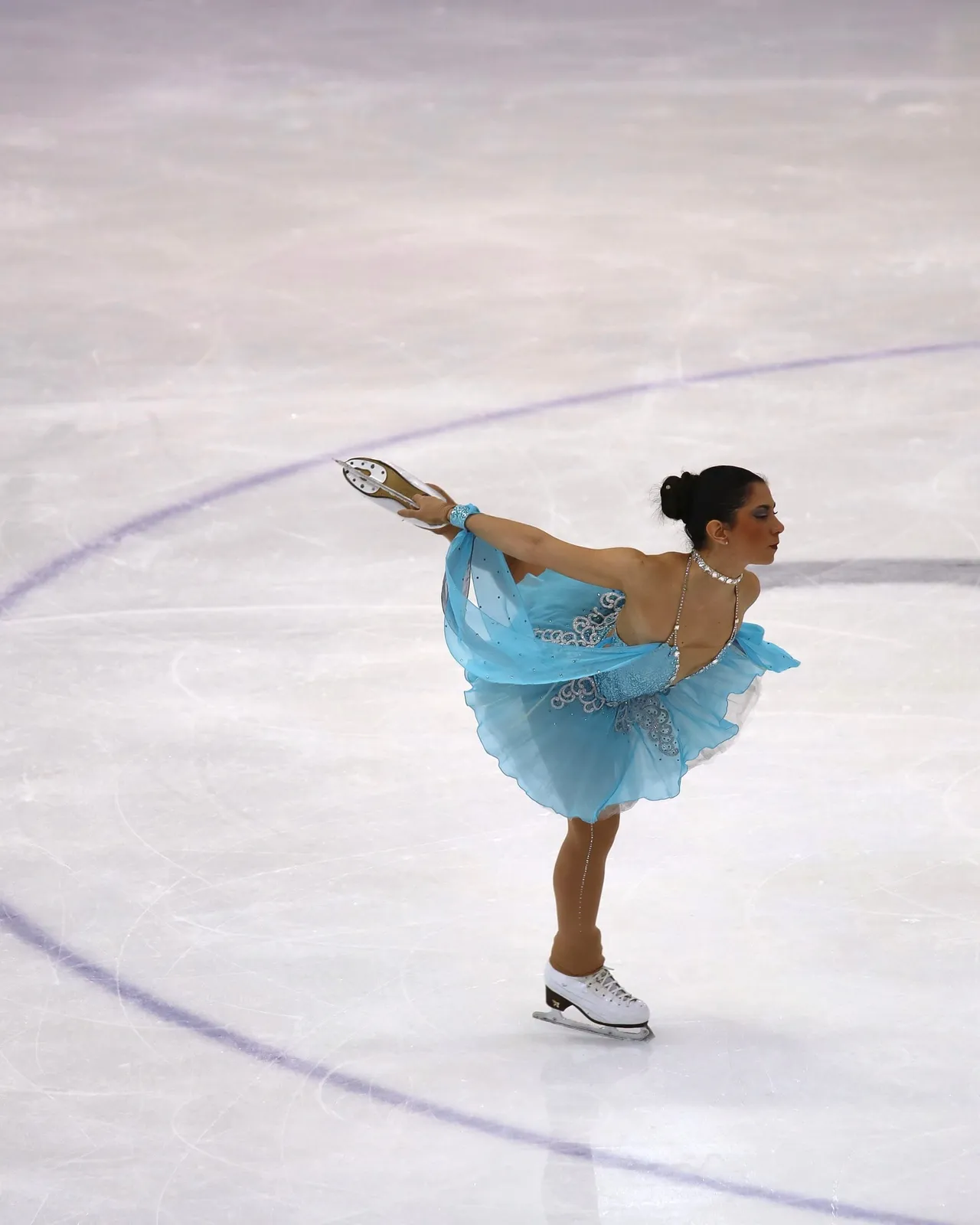 Torino 2025 FISU — figura dinamica di pattinaggio artistico.